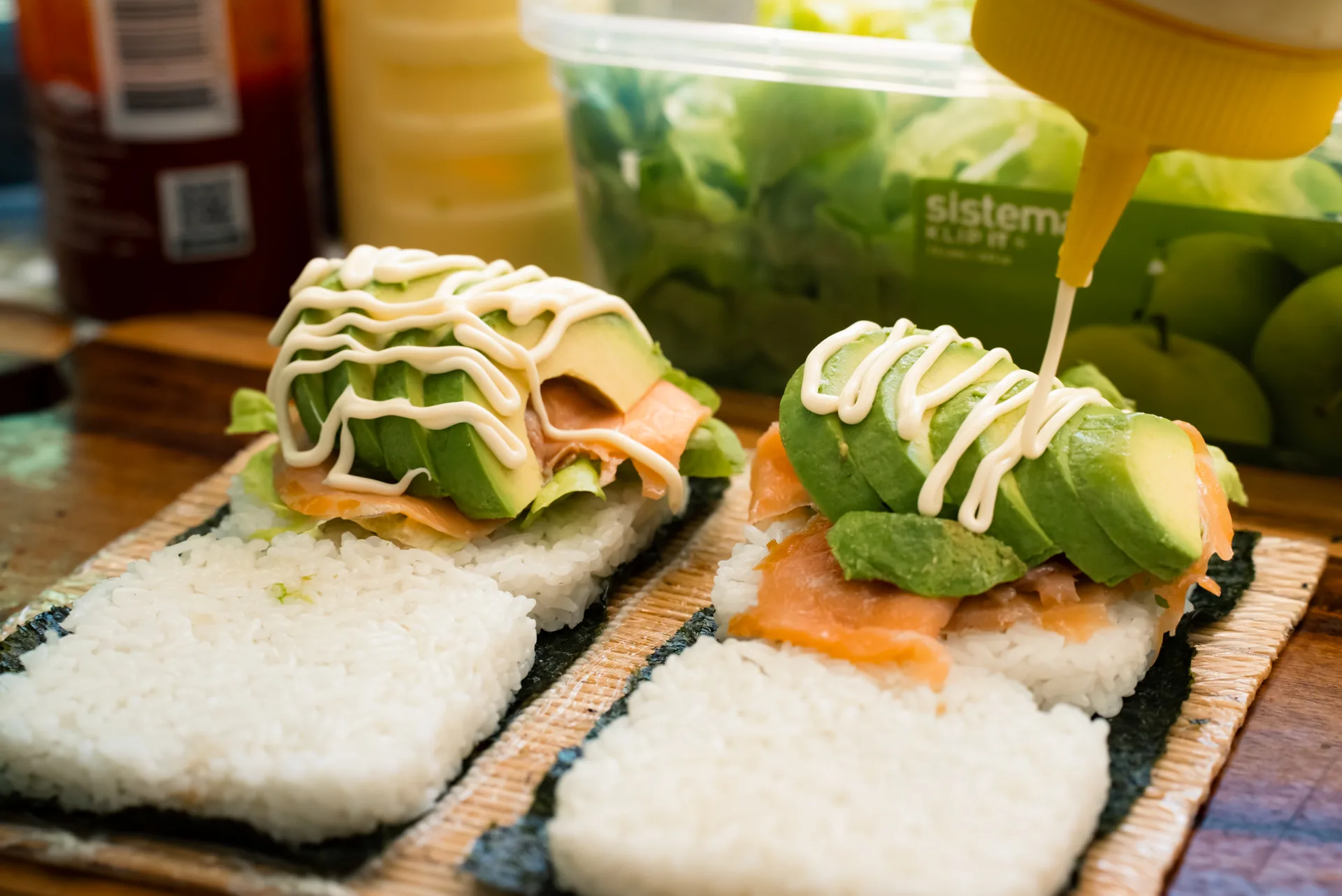 Smoked salmon and avocado Oh!NIGIRI rice burgers being finished