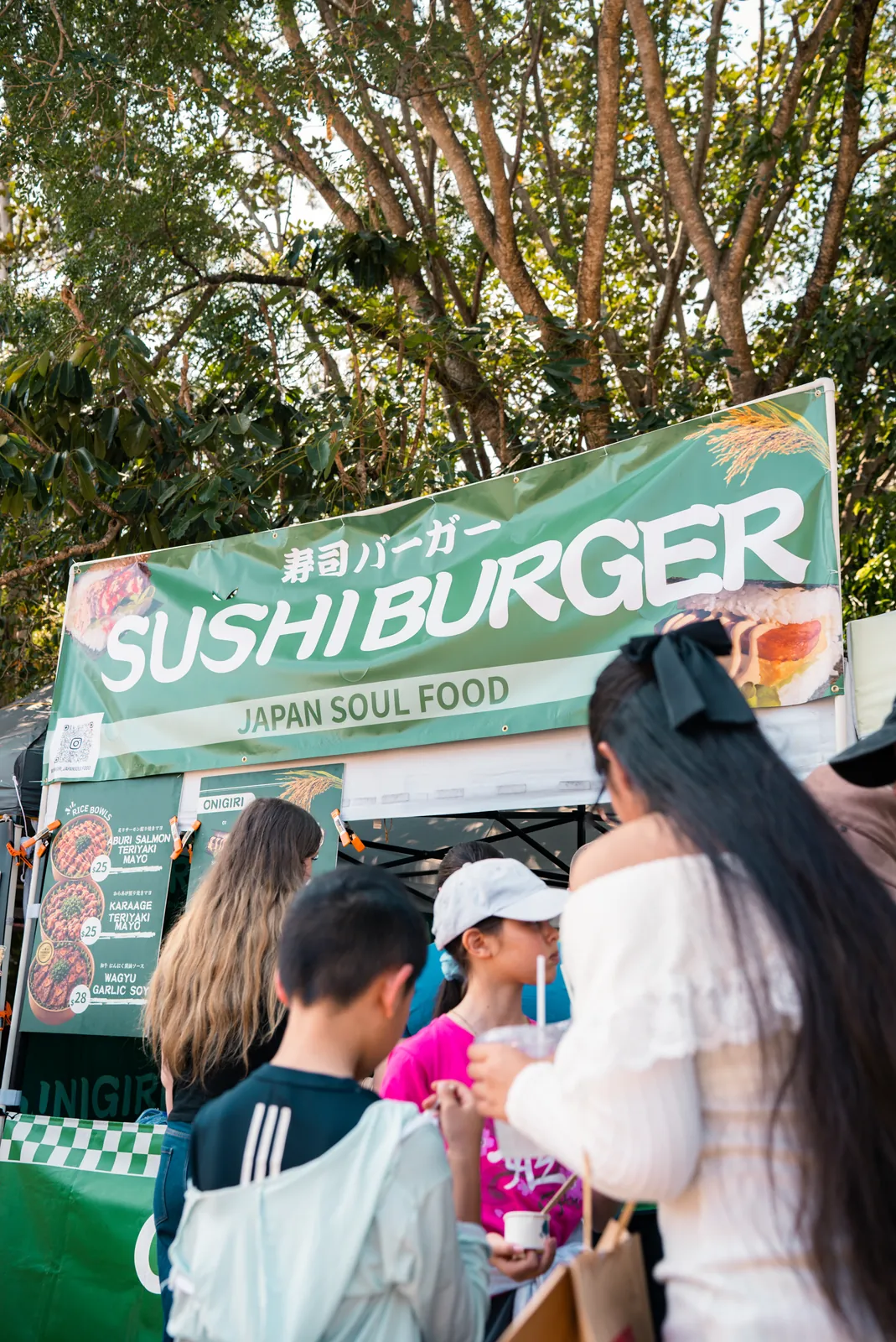 Customers ordering at the Oh!NIGIRI market stall