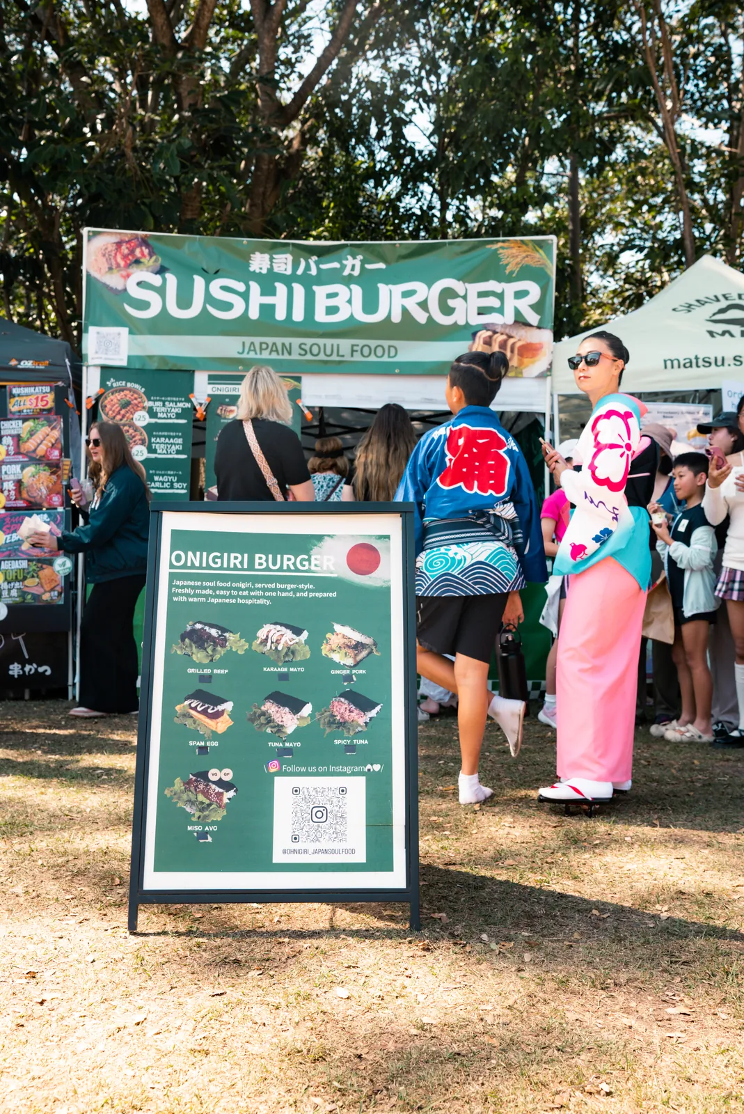 Oh!NIGIRI stall facade with menu signage and market visitors