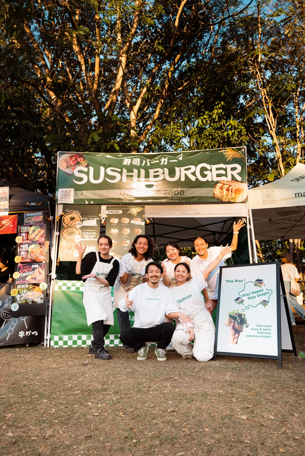 Six Oh!NIGIRI team members together in front of the stall