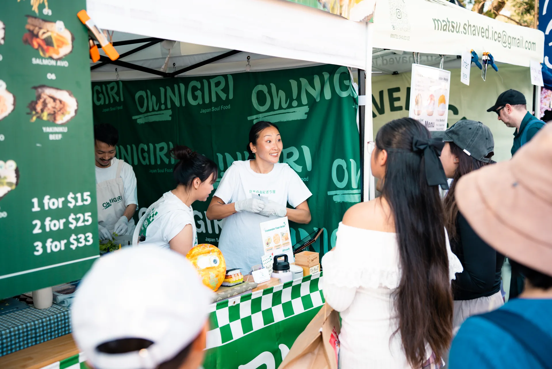 Oh!NIGIRI stall serving customers during a busy market